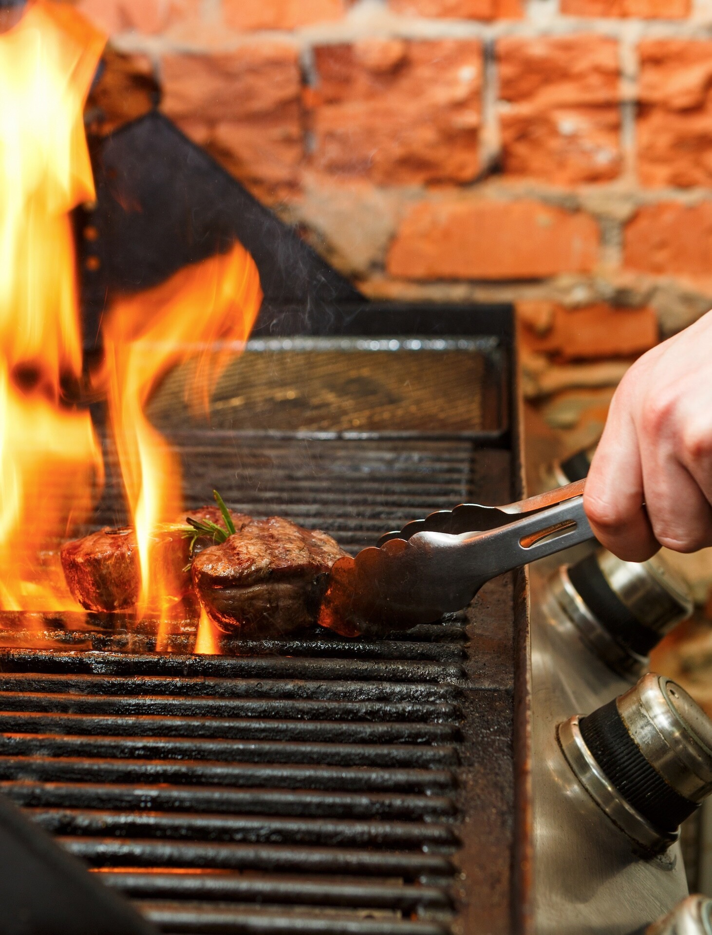 man-cooking-meat-steaks-on-professional-grill-outd-2026-03-24-03-02-56-utc